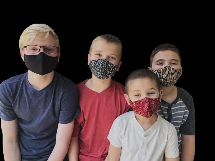 Picture showing boys wearing face masks in different sizes